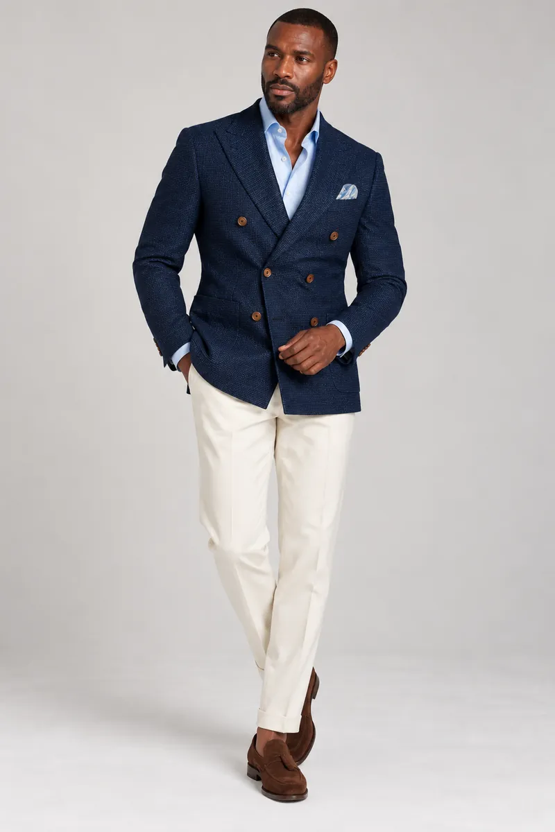 Navy hopsack double-breasted jacket photographed on the wearer